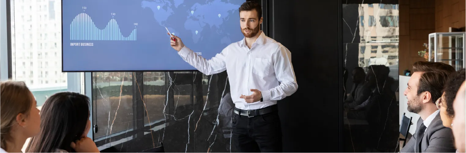 Business meeting with people discussing property map on a wall